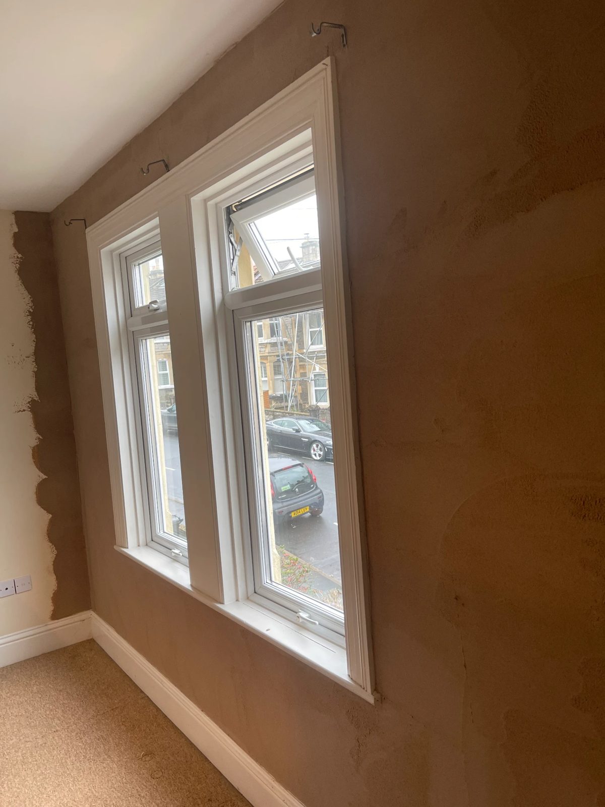 Newly plastered wall and window reveals in a Bath terraced house