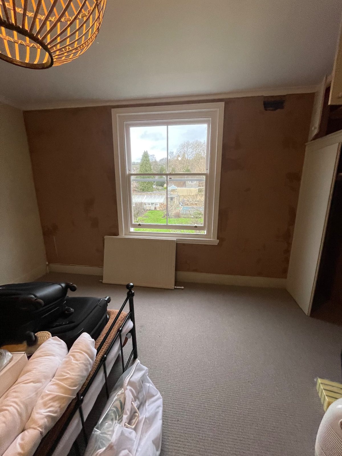 Bedroom with the walls freshly replastered and the room left clean