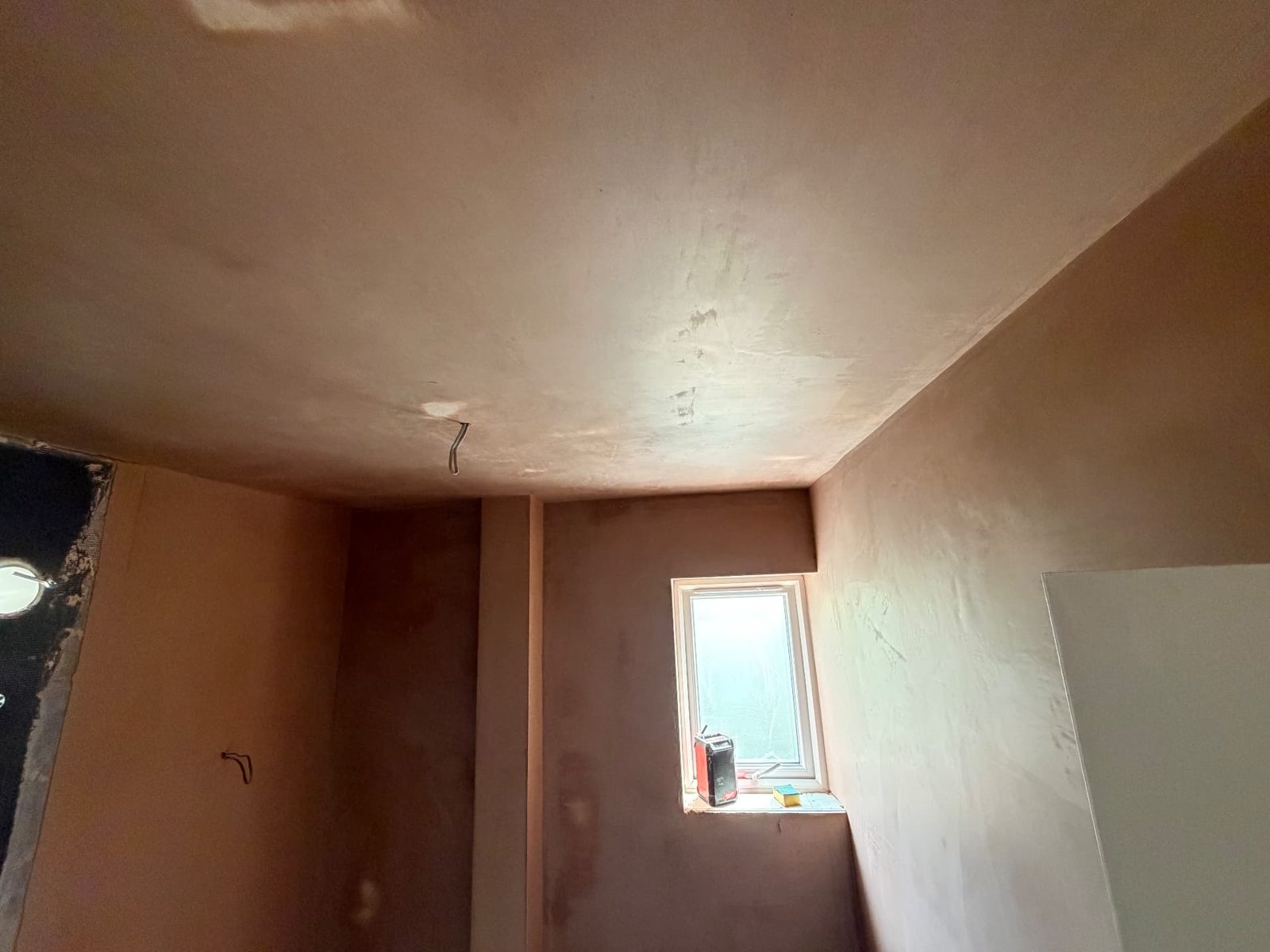 Room with the ceiling and walls skimmed to a flat plaster finish