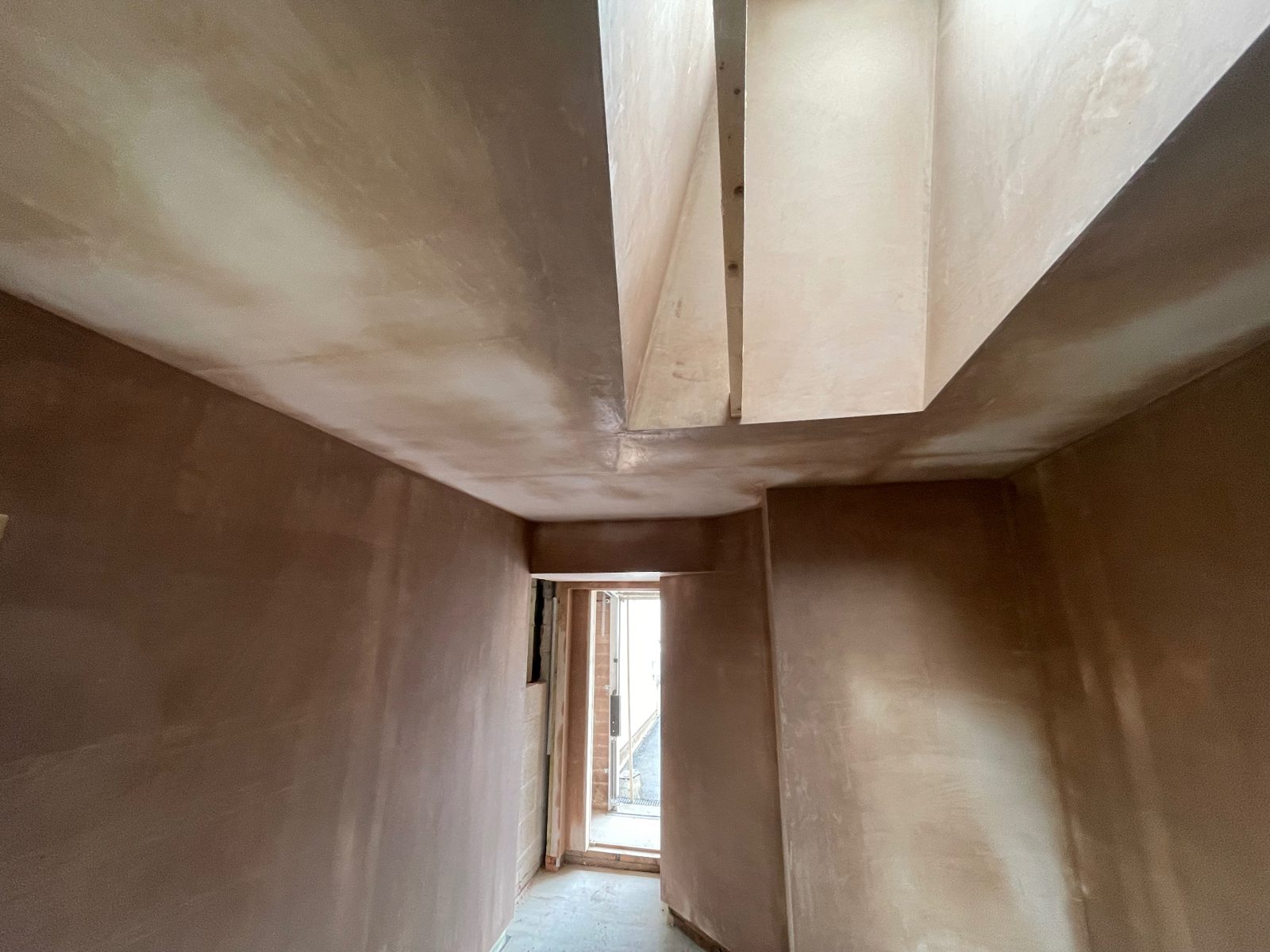 Hallway walls and ceiling replastered and left ready for decorating