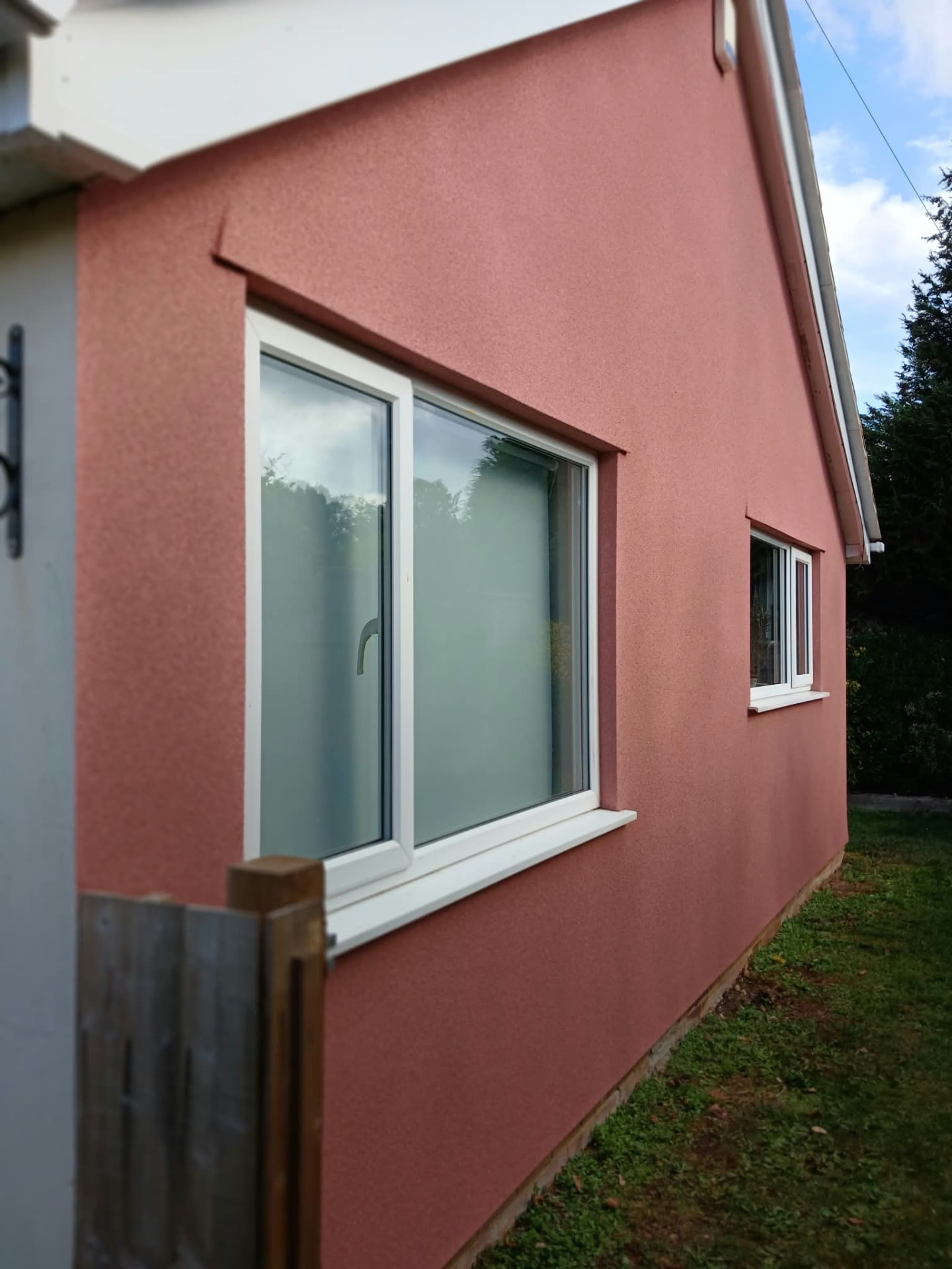 After work in Frome: textured exterior cork finish around the larger window and along the elevation
